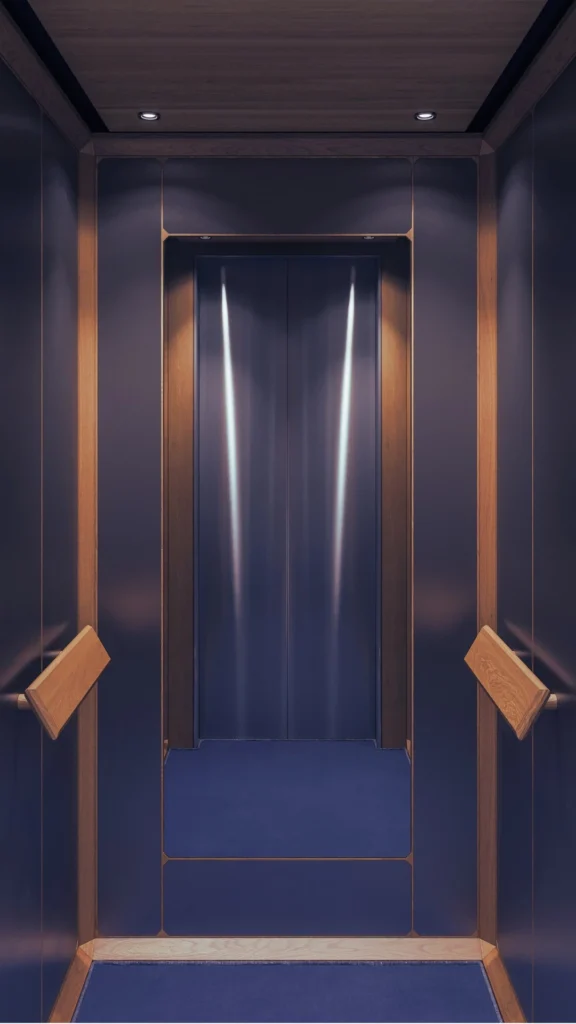 A symmetrical, front-facing view inside an empty elevator cab showcasing a premium elevator interior design with sophisticated lighting. The back of the cabin features metallic blue-gray sliding doors accented by sharp, vertical beams of overhead light reflection. The side and back wall panels are finished in a smooth, matte slate blue, framed by rich, warm-toned wood trim along the corners and baseboards. Thick, angled wooden handrails are mounted on both side walls. The flat wooden ceiling is equipped with small recessed spotlights, casting a soft glow down onto the clean, deep blue carpeted floor.