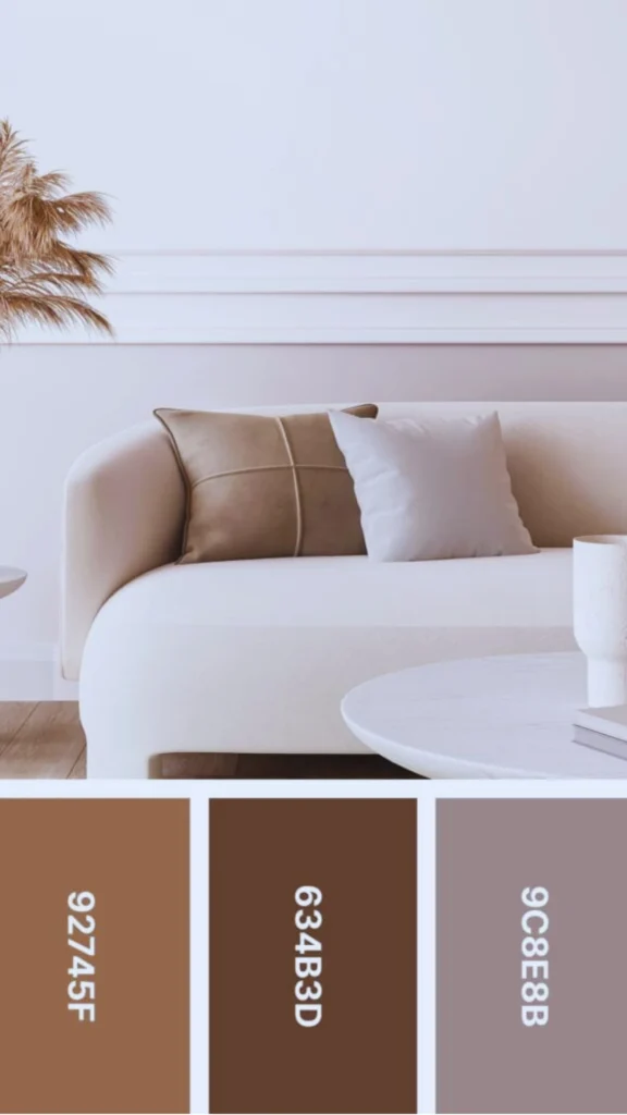 A minimalist, high-end living room scene featuring a cream-colored curved sofa acting as a neutral canvas. The sofa is styled with taupe and soft grey accent pillows. To the side and in front are white stone tables holding textured ceramic vases and delicate dried botanicals. The lower portion of the image displays five square color swatches representing a warm neutral palette: taupe, camel, deep mushroom brown, soft greige, and light cream, each labeled with its hex code. The overall aesthetic is one of restraint and curated luxury.